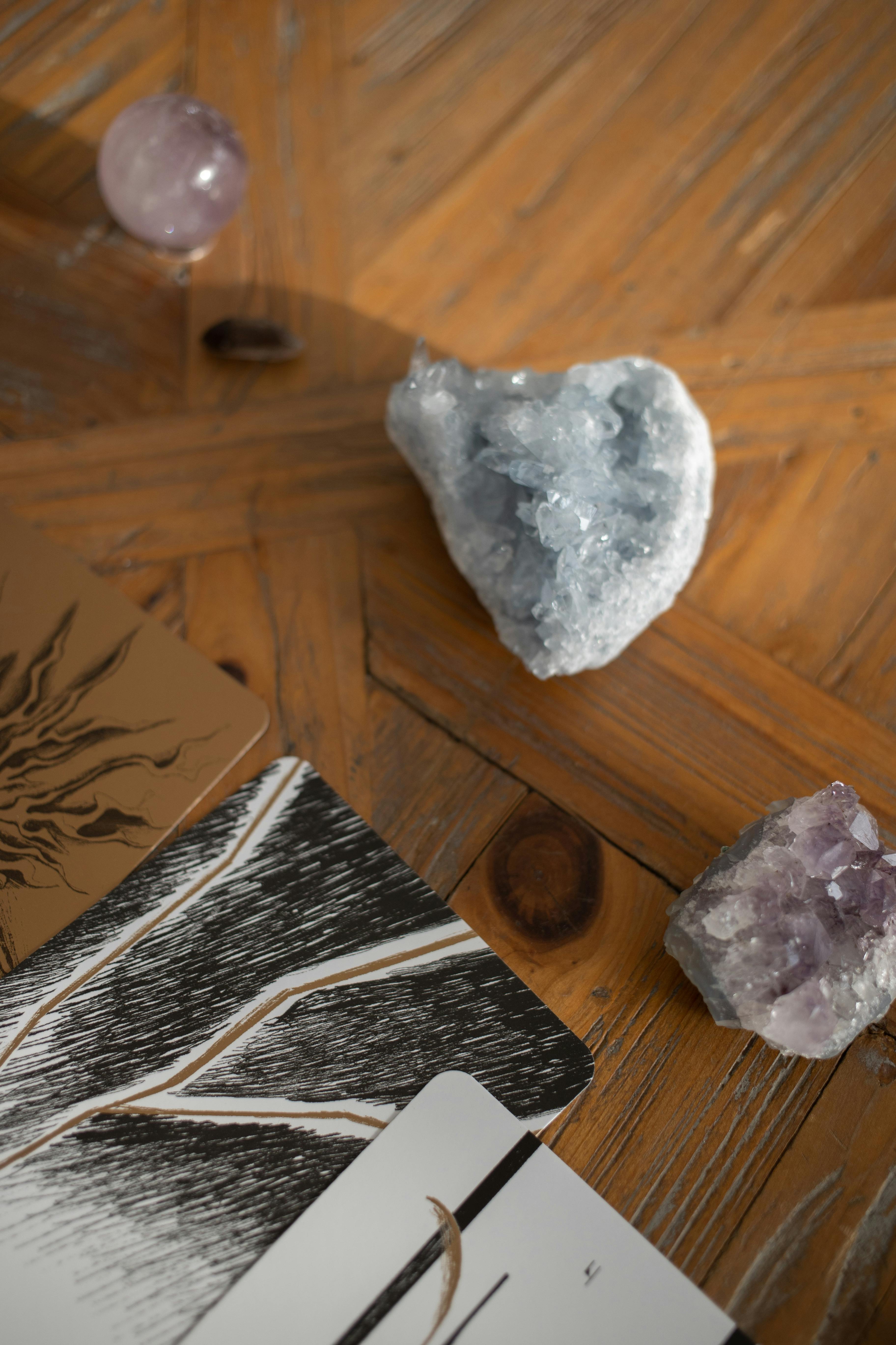A mystical arrangement of tarot cards and healing crystals on a wooden surface, capturing spiritual vibes.