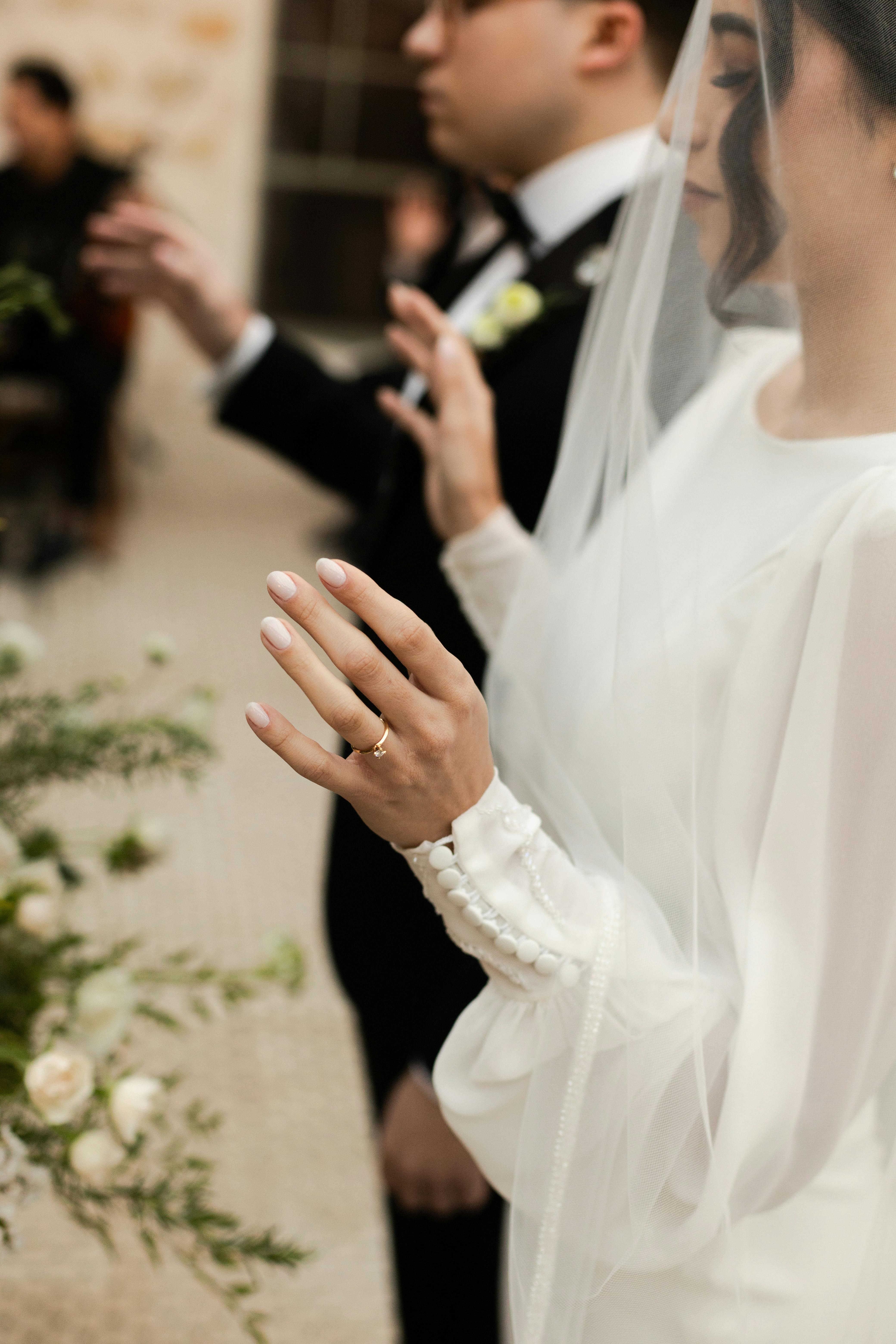 Bride and groom holding hands during a ceremony in São Paulo, Brasil.