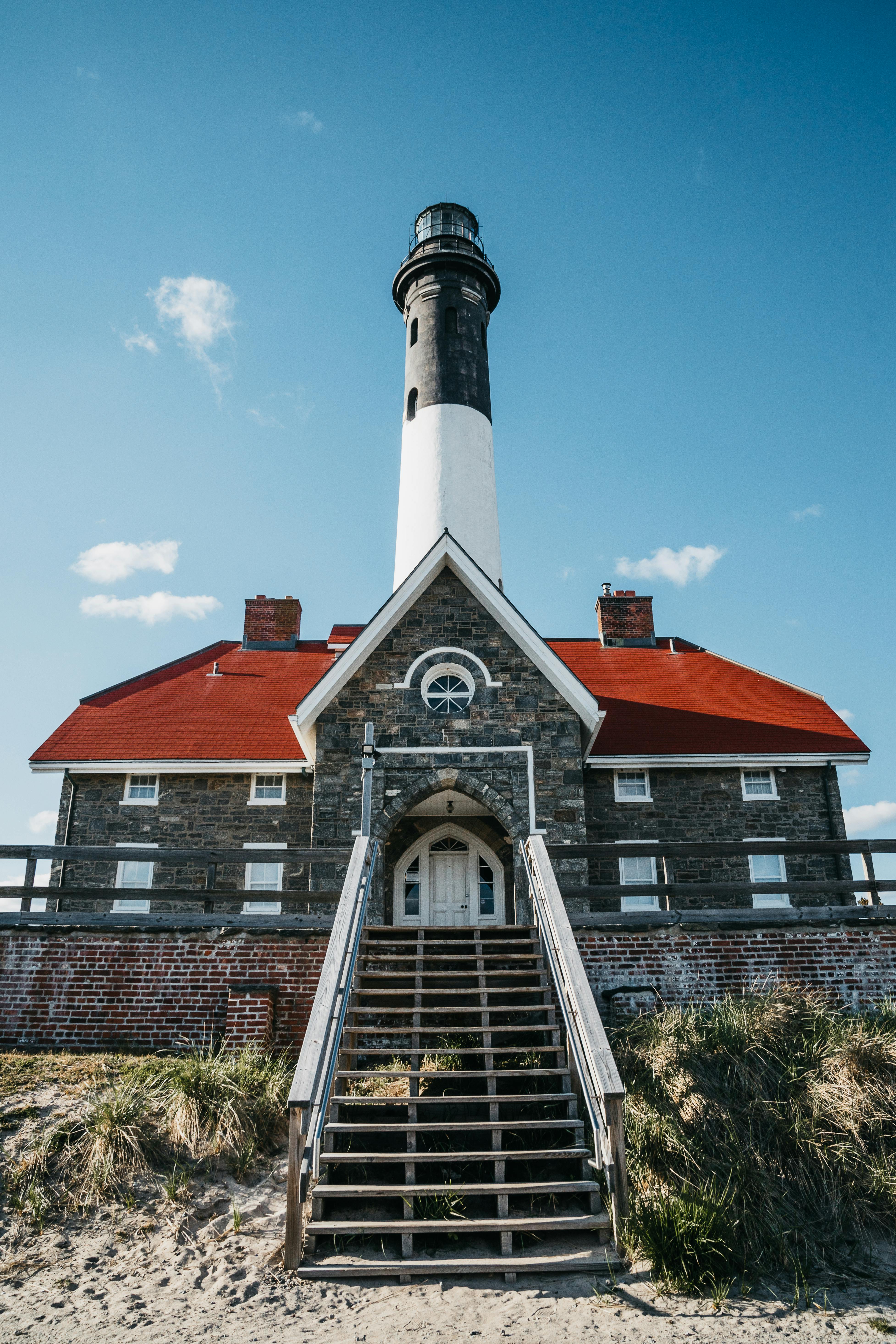 Stunning view of the historic Montauk Lighthouse on a clear, sunny day.